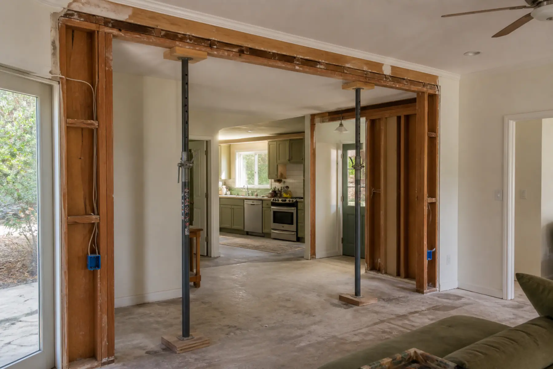 Partially opened bearing wall with temporary shoring in a California ranch house remodel